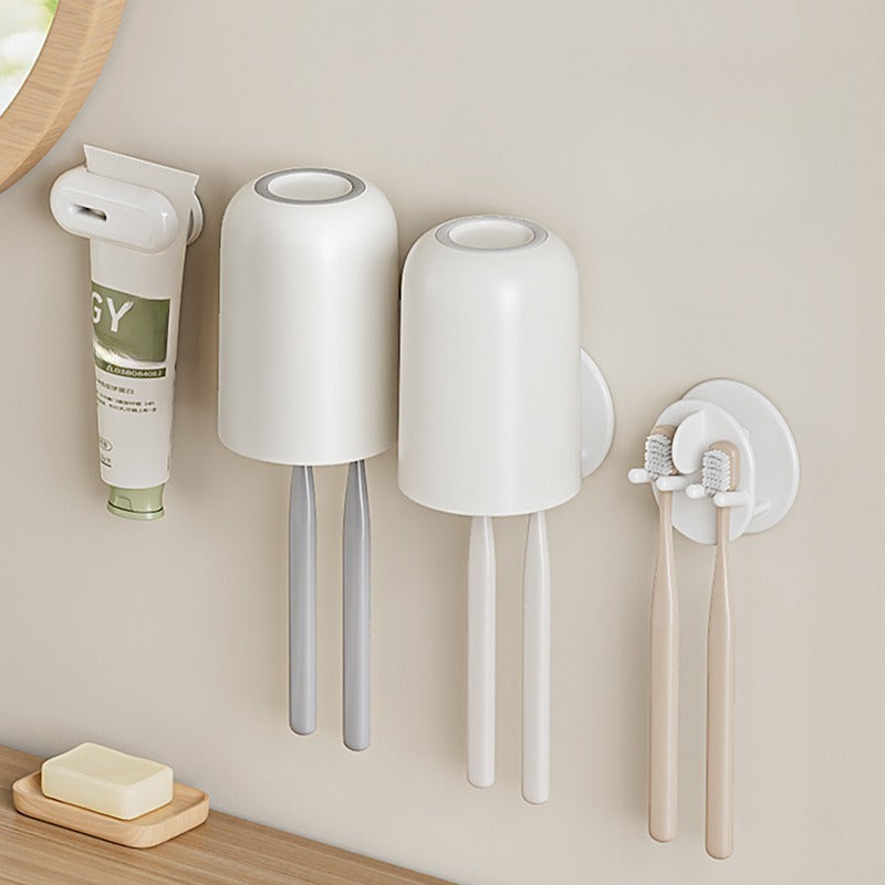 Wall-mounted self-draining toothbrush and razor holder
