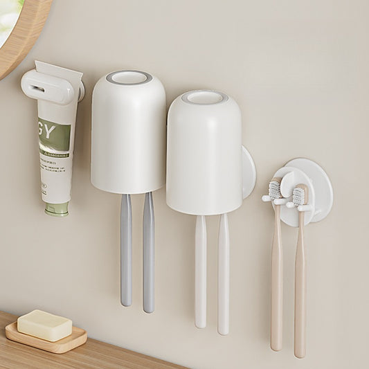 Wall-mounted self-draining toothbrush and razor holder