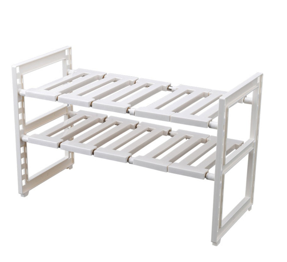 Expandable under-sink storage rack with shelves
